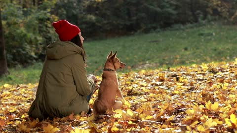 Woman and her dog outside