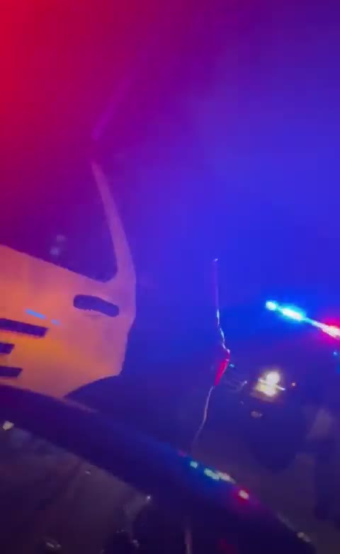 Gentlemen gives his opinion as he drives by the police cordon at Trump's Mar-A-Lago.