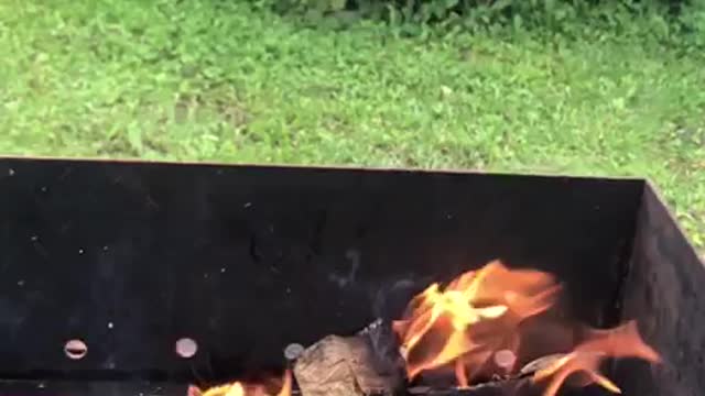 Flames from the barbecue fire