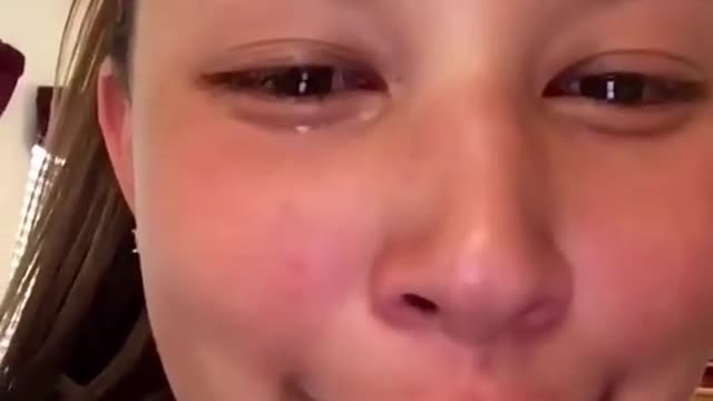 Girl cries because dogs don't like hugs