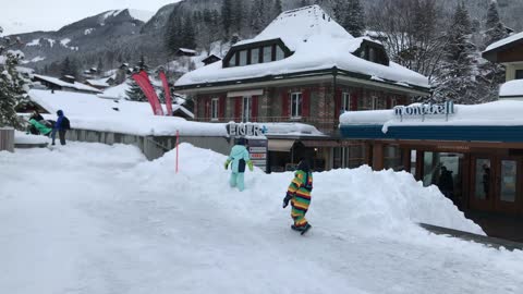 babies playing in the snow