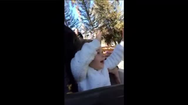 Little girl's very first roller coaster ride