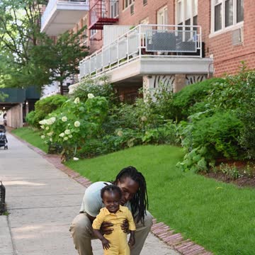 Baby hysterically laughs at totally while lifting him and playing with him