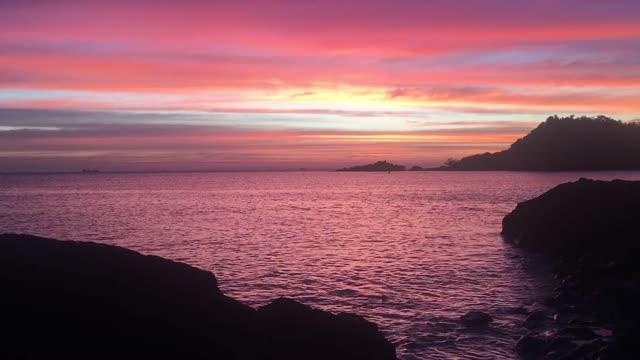 The beautiful sunset on the beach makes the sea transparent