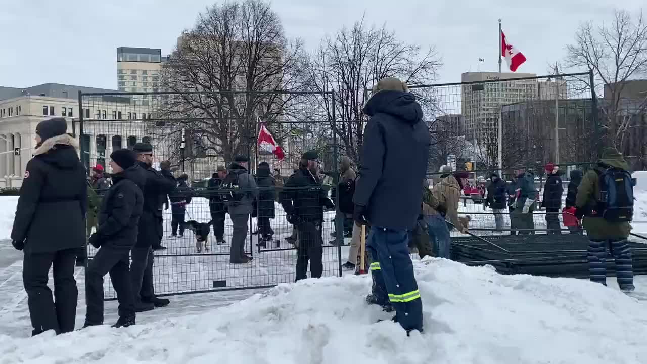 Ottawa: Protesters, many of whom are veterans, removing fencing that was put up at the war memorial