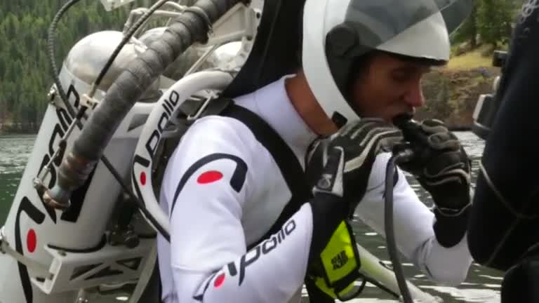 Jet pack pilot performs amazing water stunt