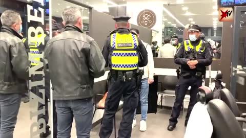 In Hamburg, Germany police enter a business to check if they are compliant with COVID