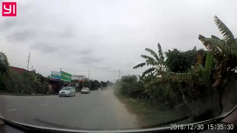 Motorcyclist Has Close Call with Utility Truck