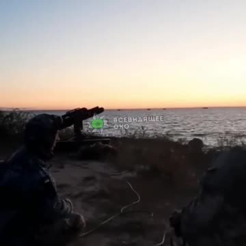 Ukrainian soldiers fire at hostile targets on the left bank of the Dnieper