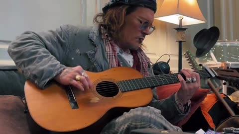 Johnny Depp strums to Smashing pumpkins