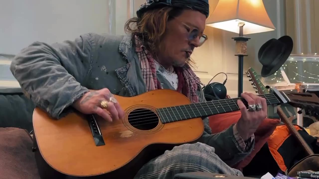 Johnny Depp strums to Smashing pumpkins