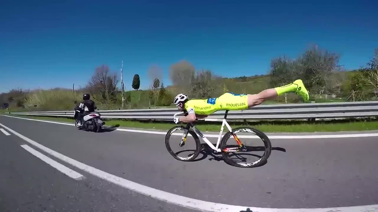 This is a cyclist using his knowledge of physics and aerodynamics to gain a competitive advantage