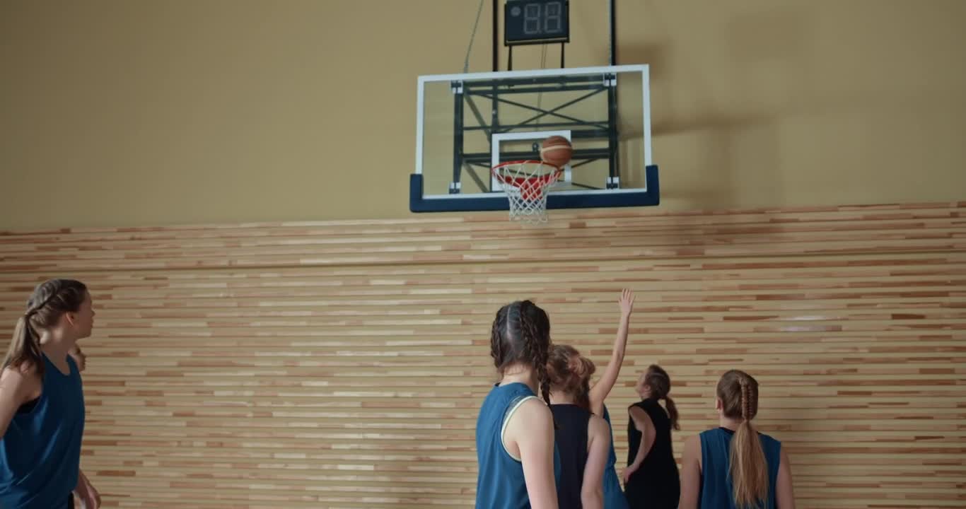 Woman Scoring a Goal in Basketball