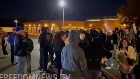 Protesters are now blocking the roadway so the Sanitation Trucks can't leave the station.