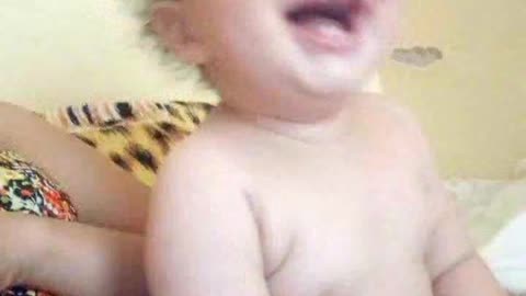 Cute baby laughing a lot.