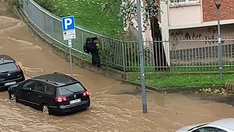 Pedestrian Stays Dry During a Flood