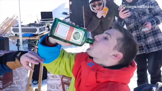Guy downs bottle of jager and then goes snowboarding and reverse scorpions