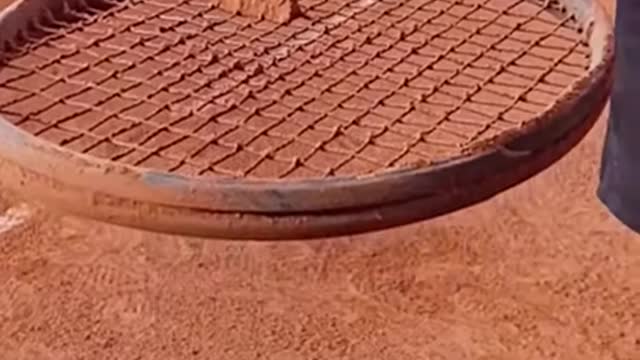 Getting ride of the sand on this Tennis racket