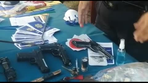 A video of law enforcement officers who had confiscated weapons and drugs at schools