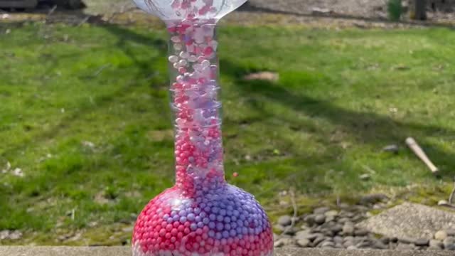 Moving Beads in Glass Bottles.