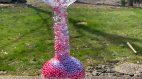 Moving Beads in Glass Bottles.