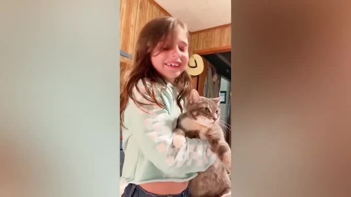 Amazing Cat is answering the girl's words.
