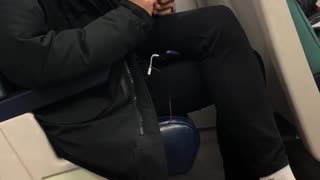 Guy clips his fingernails on subway train