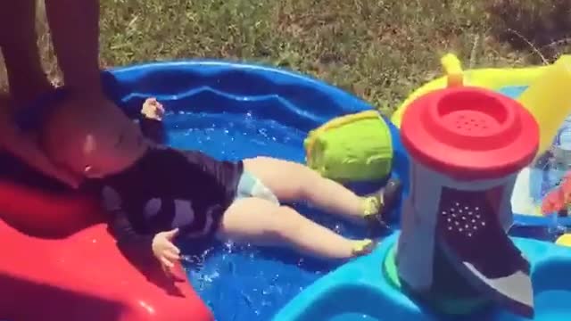 Collab copyright protection - baby slides down waterslide