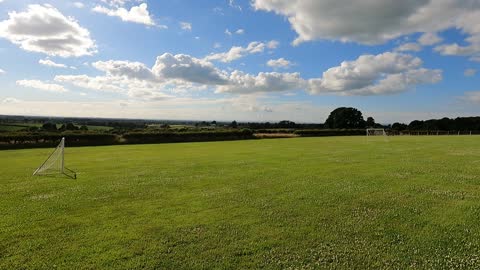 On field on sunny and cloudy day in Cumbria.