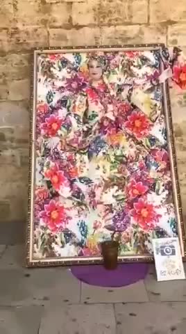 A camouflaged talented street artist