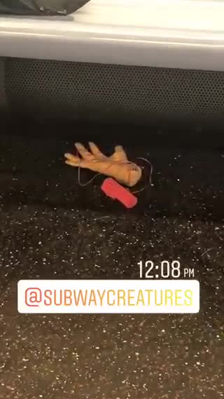 Random hand toy left on nyc subway train