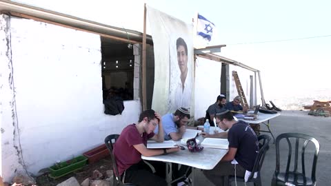 Torches light up battle over Israeli settlement