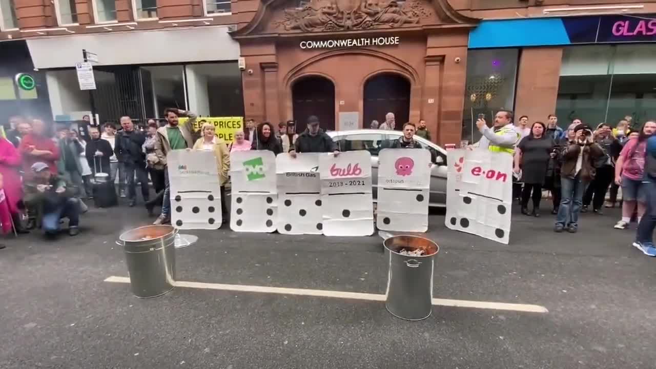 Glasgow, Scotland protesters burning their electricity bills outside of the energy regulator - 08-26