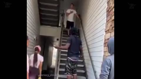 a group of guys attacking a man from behind