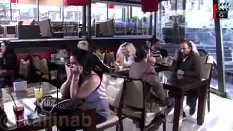 The reaction of the women in the restaurant: