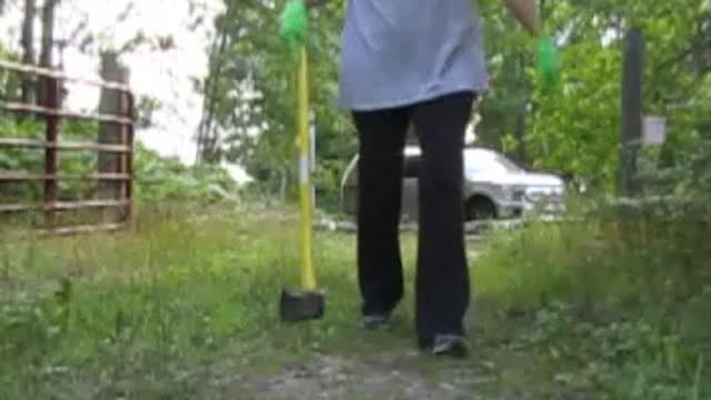 GIRL CHOPS TREE OUT OF THE WAY