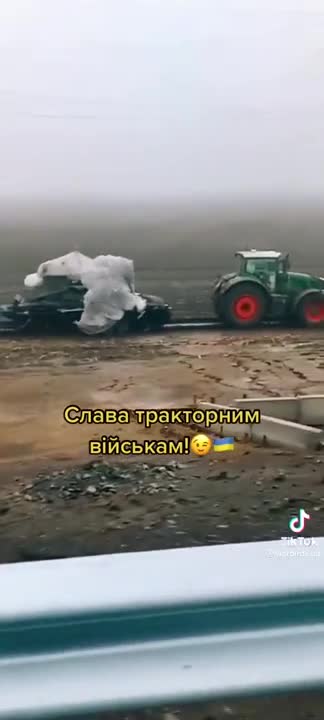 Ukrainian farmers with a captured Russian TOS-1A thermobaric MLRS BM-1 launcher