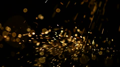 Sparks hitting a black surface in slow motion