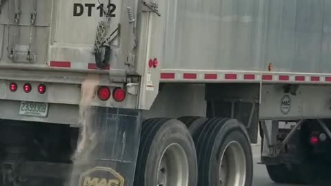 Semi Spilling Sand on the Street