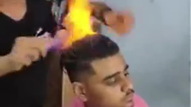 Head on fire, hillarous hairstyle gone wrong.