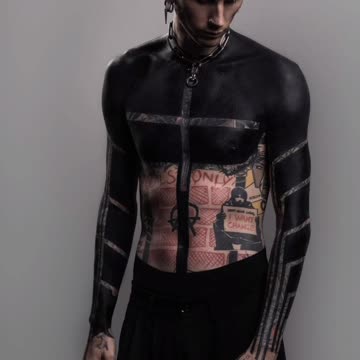 Machine Gun Kelly with some new ink