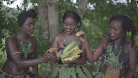 The Beauty of Africa Three African ladies as they share sweet yellow bananas