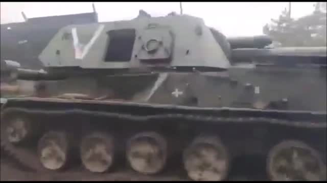 A Ukrainian MT-LB Tank Pulling A Captured Russian 2S3 "Akatsiya" and MT-LB Tanks.