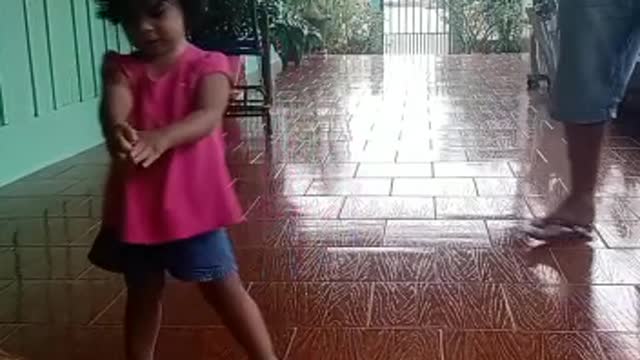 grandpa and granddaughter trying to dance