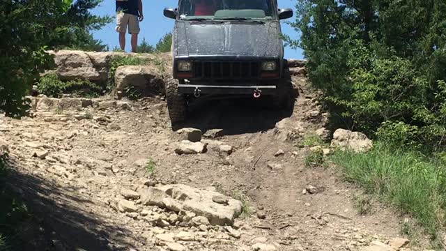 Juice Cherokee coming down a rocky wash