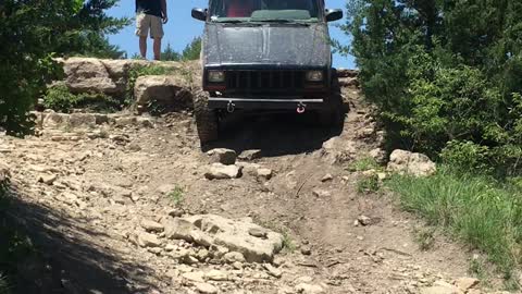 Juice Cherokee coming down a rocky wash