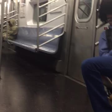 Two men asleep on train