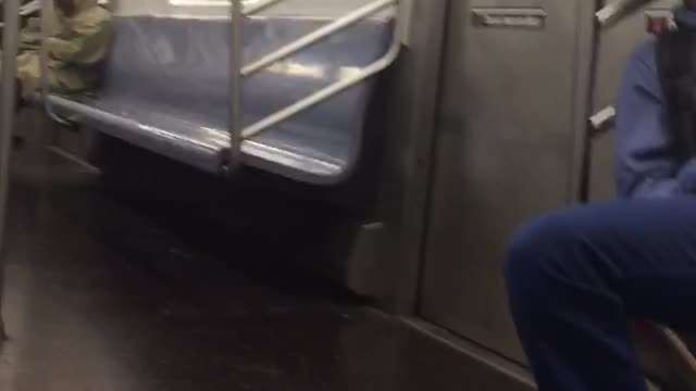 Two men asleep on train