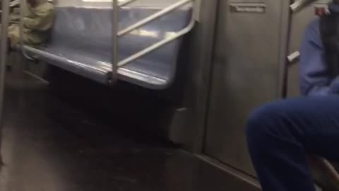 Two men asleep on train