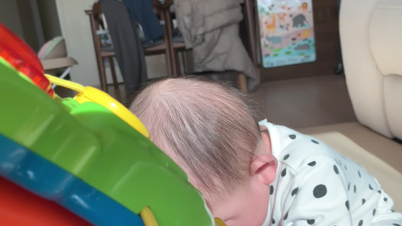 As soon as the baby wakes up, he is playing with toys